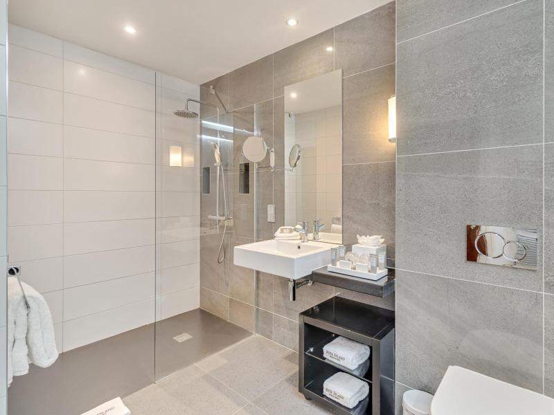 Family room bathroom image of walk in shower and sink