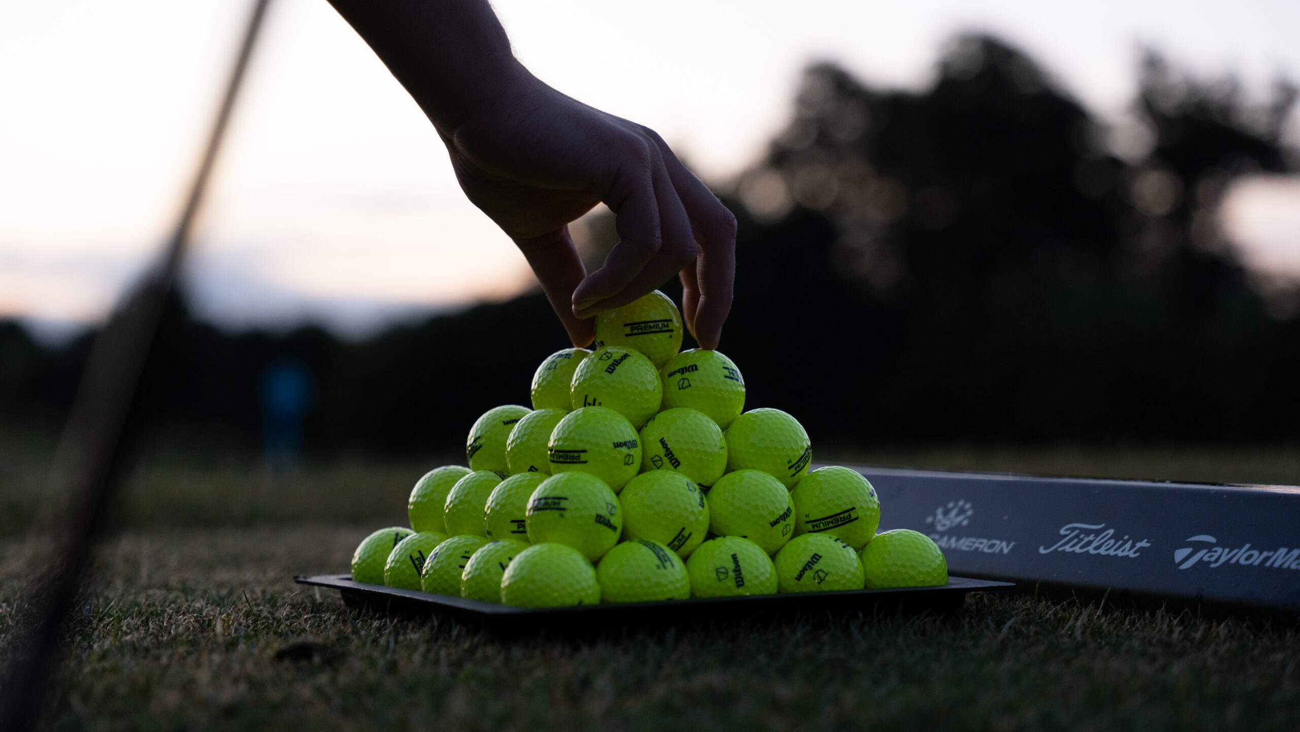 Ball pyramid set up on driving range bay