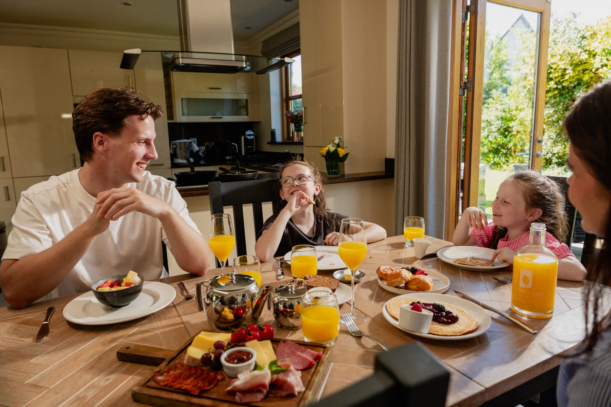 Family enjoying breakfast in a lodge