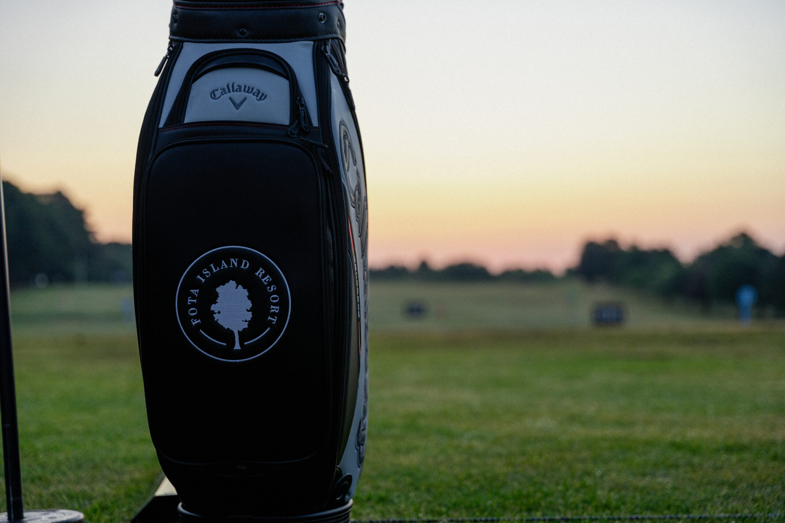 Golf bag with Fota Island Resort logo shot in sunrise