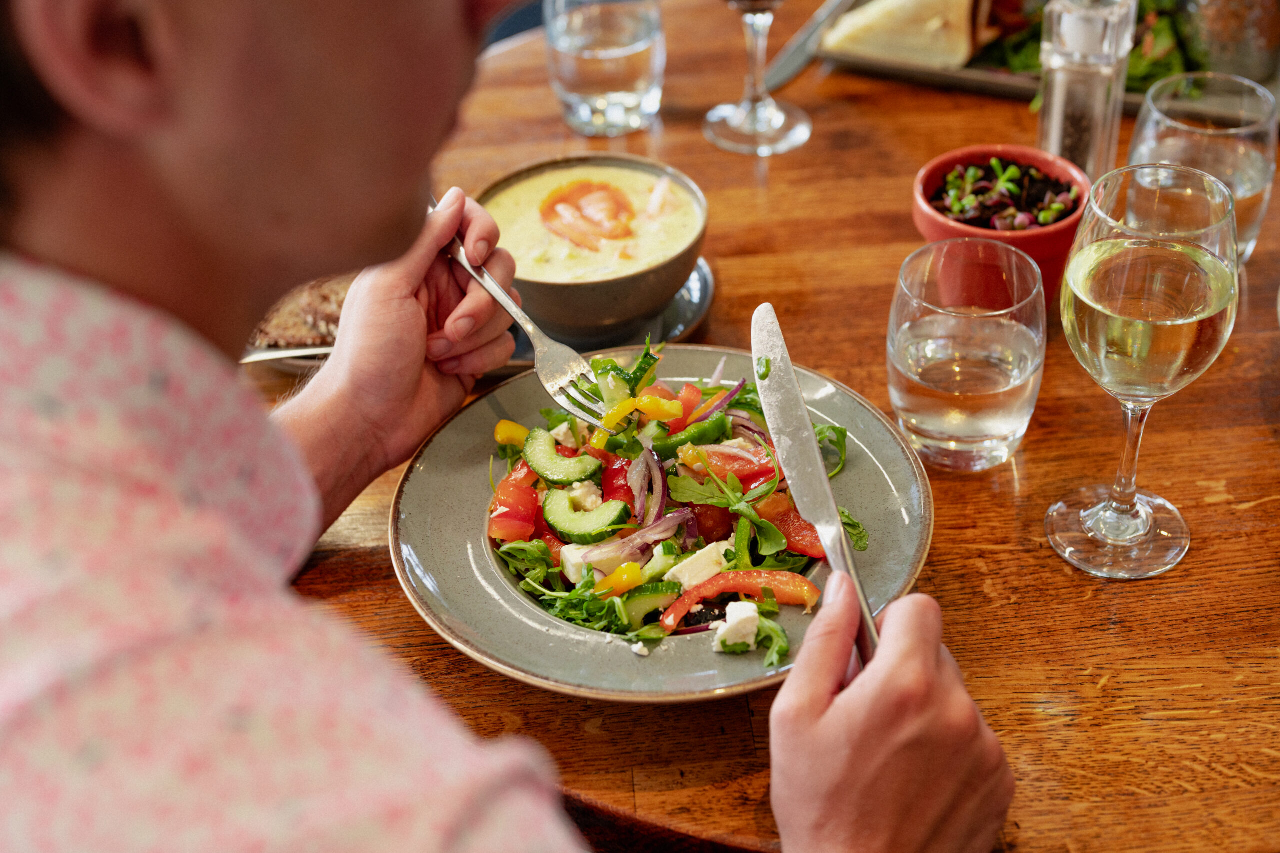 Salad and chowder on table at The Clubhouse