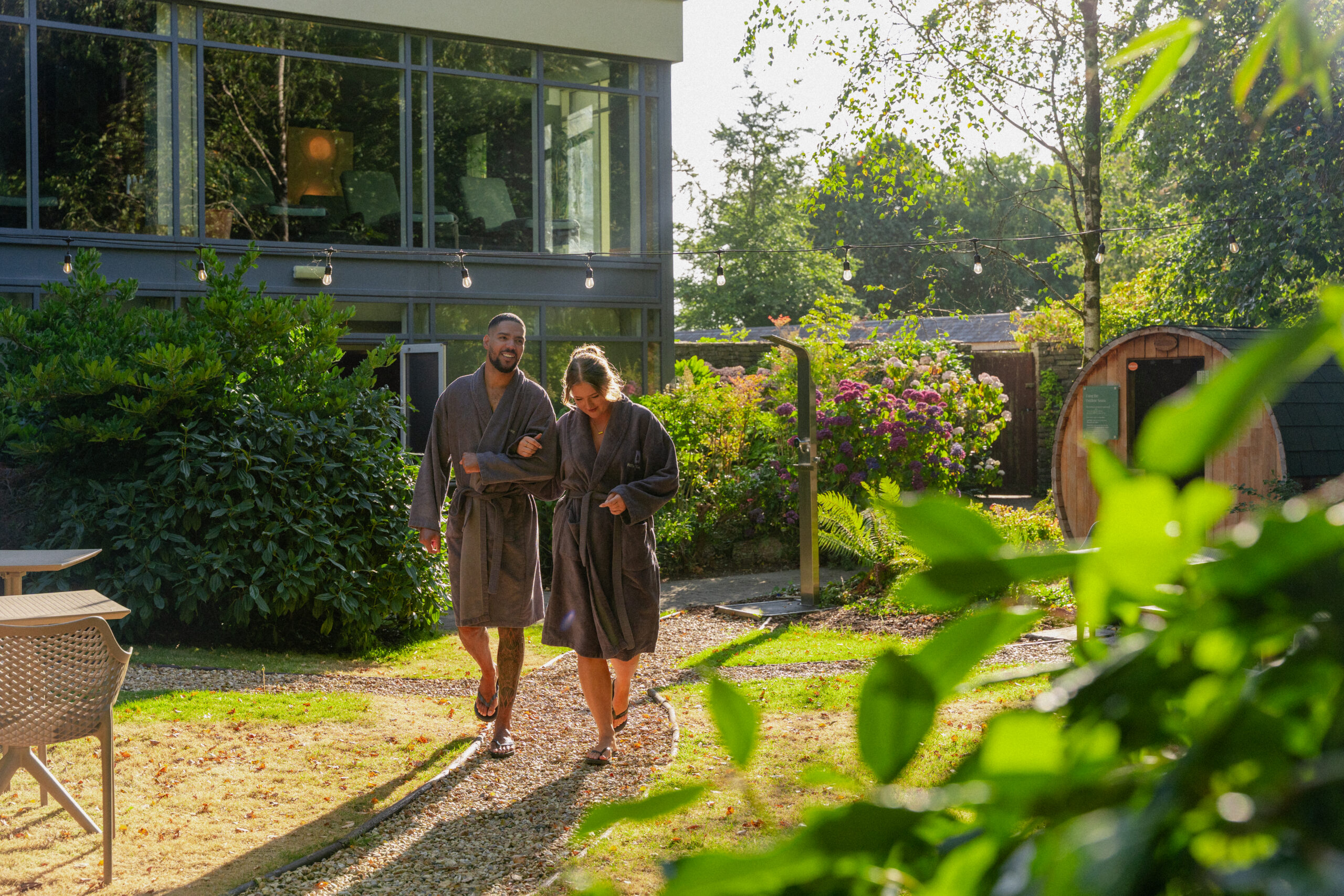 Couple walking through the spa garden