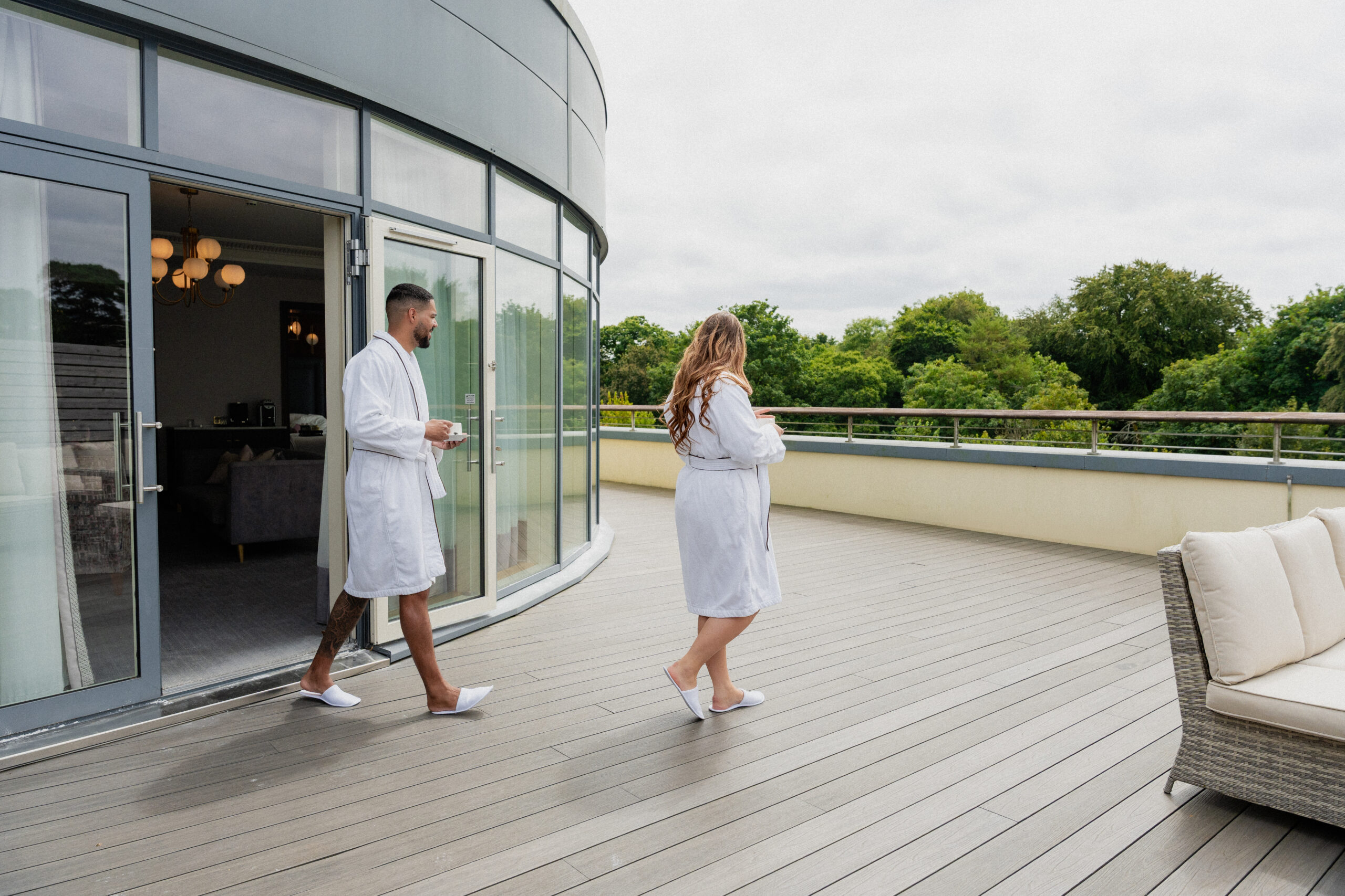 Couple walking onto balcony in the luxury suite
