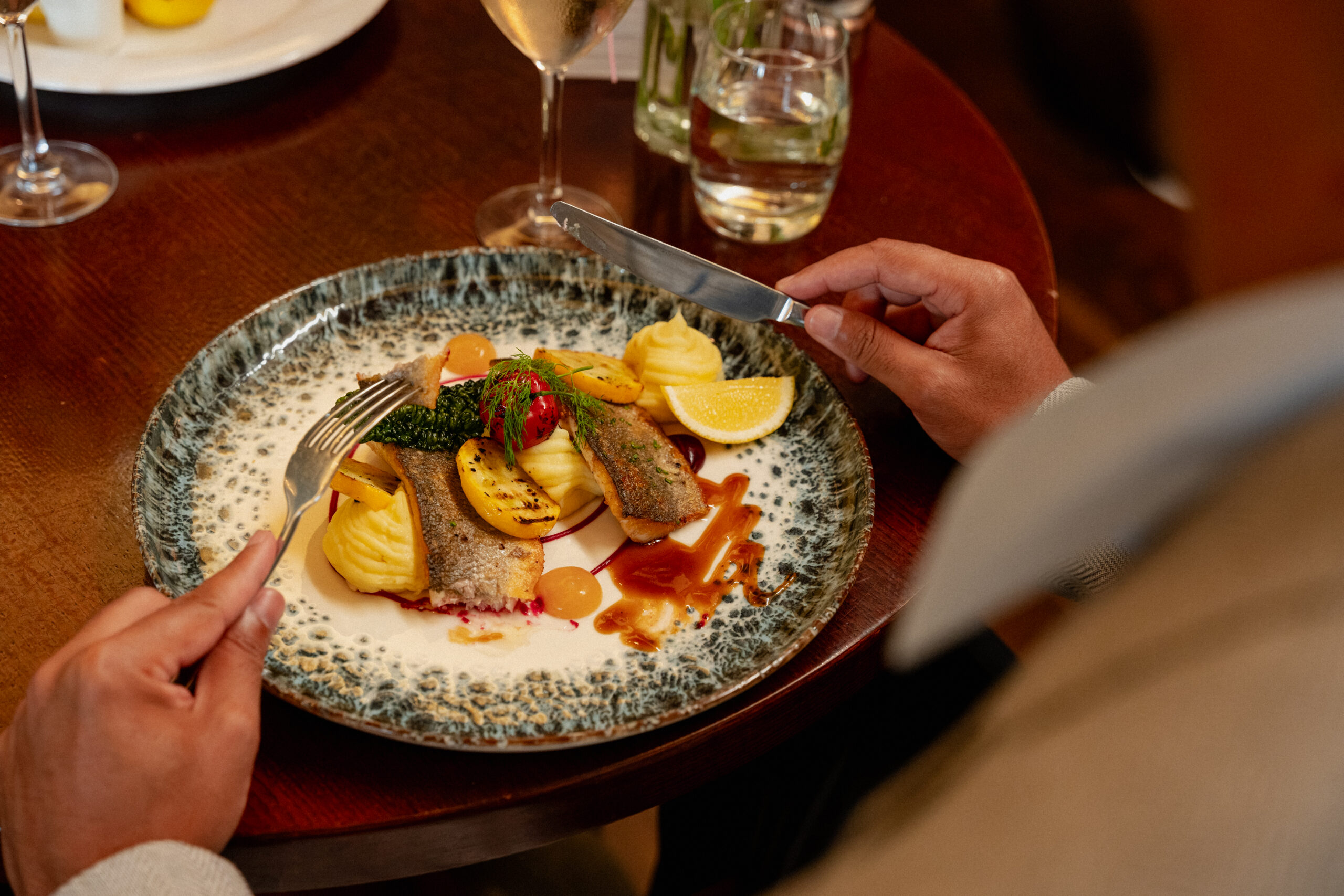 Plated fish dish on the table at The Amber Lounge