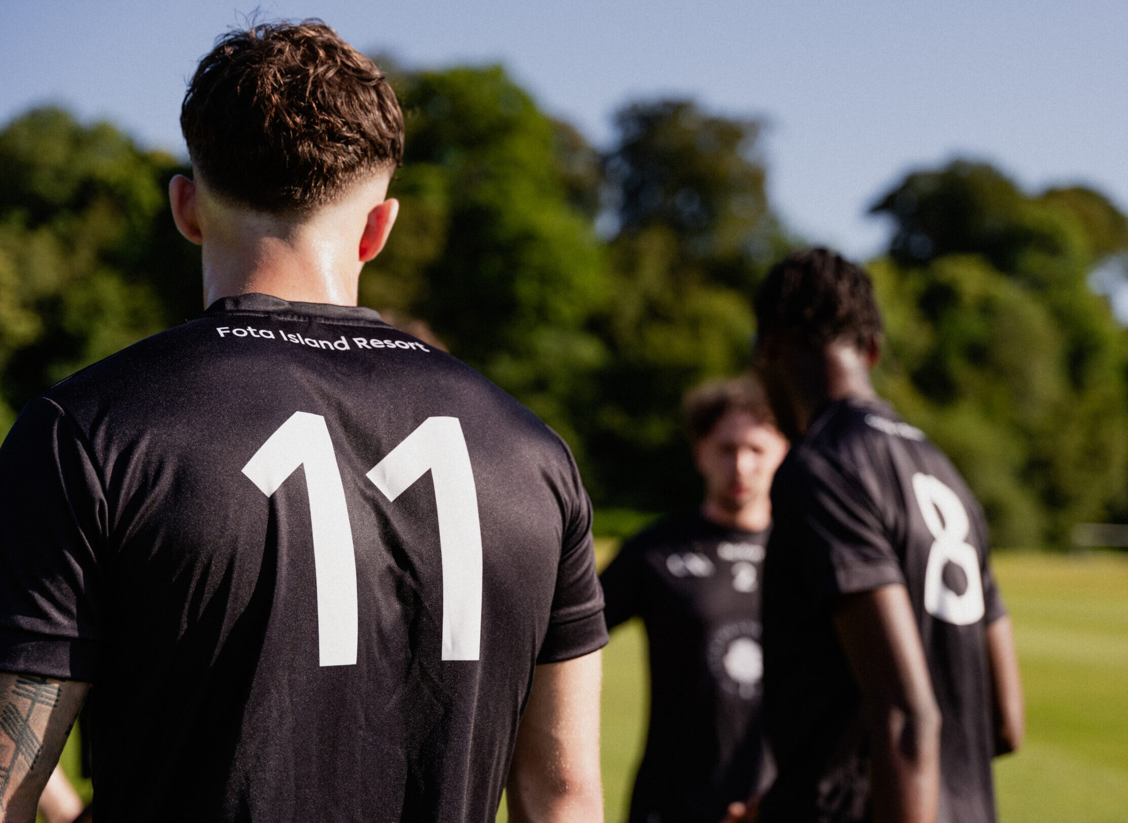 Up close image of football player wearing number 11 jersey from behind on Fota Island Resort pitches