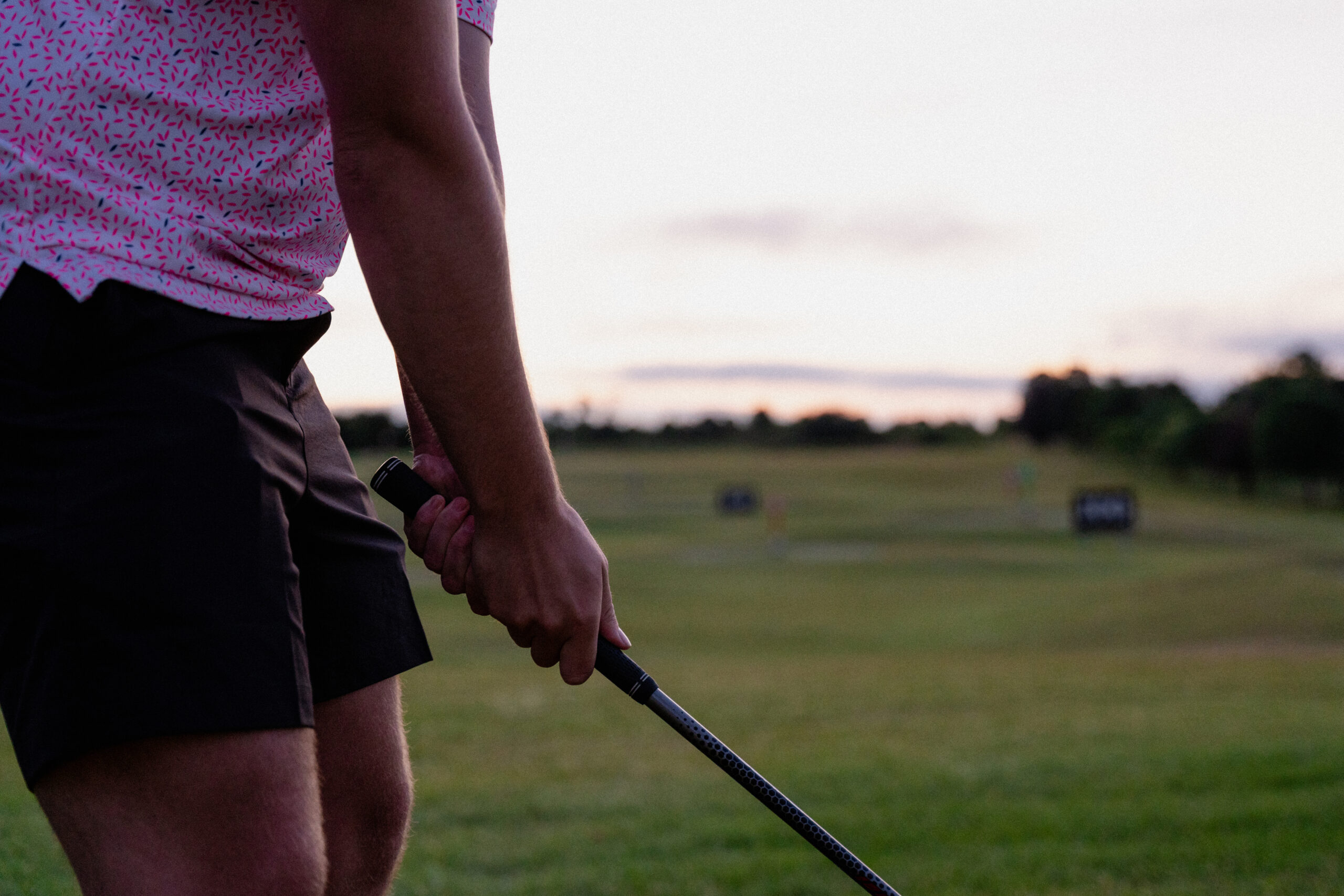 Up close shot of hands gripping golf club