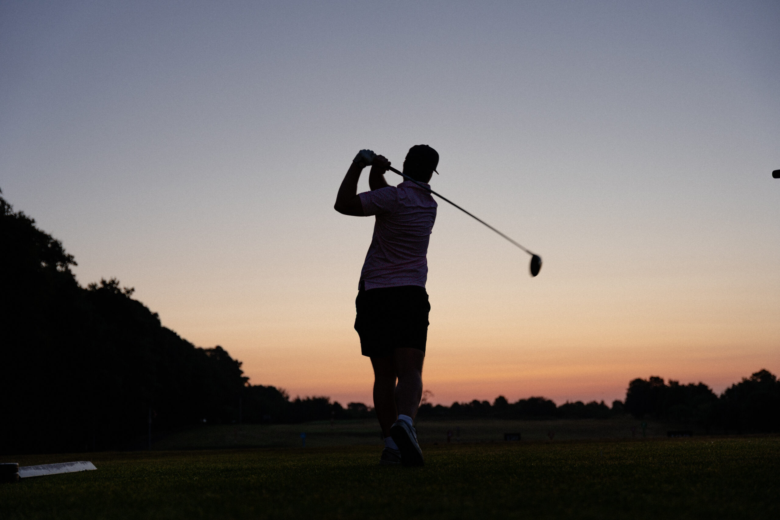 Silhouette of golfer swing at sunrise at Fota Island Golf Academy