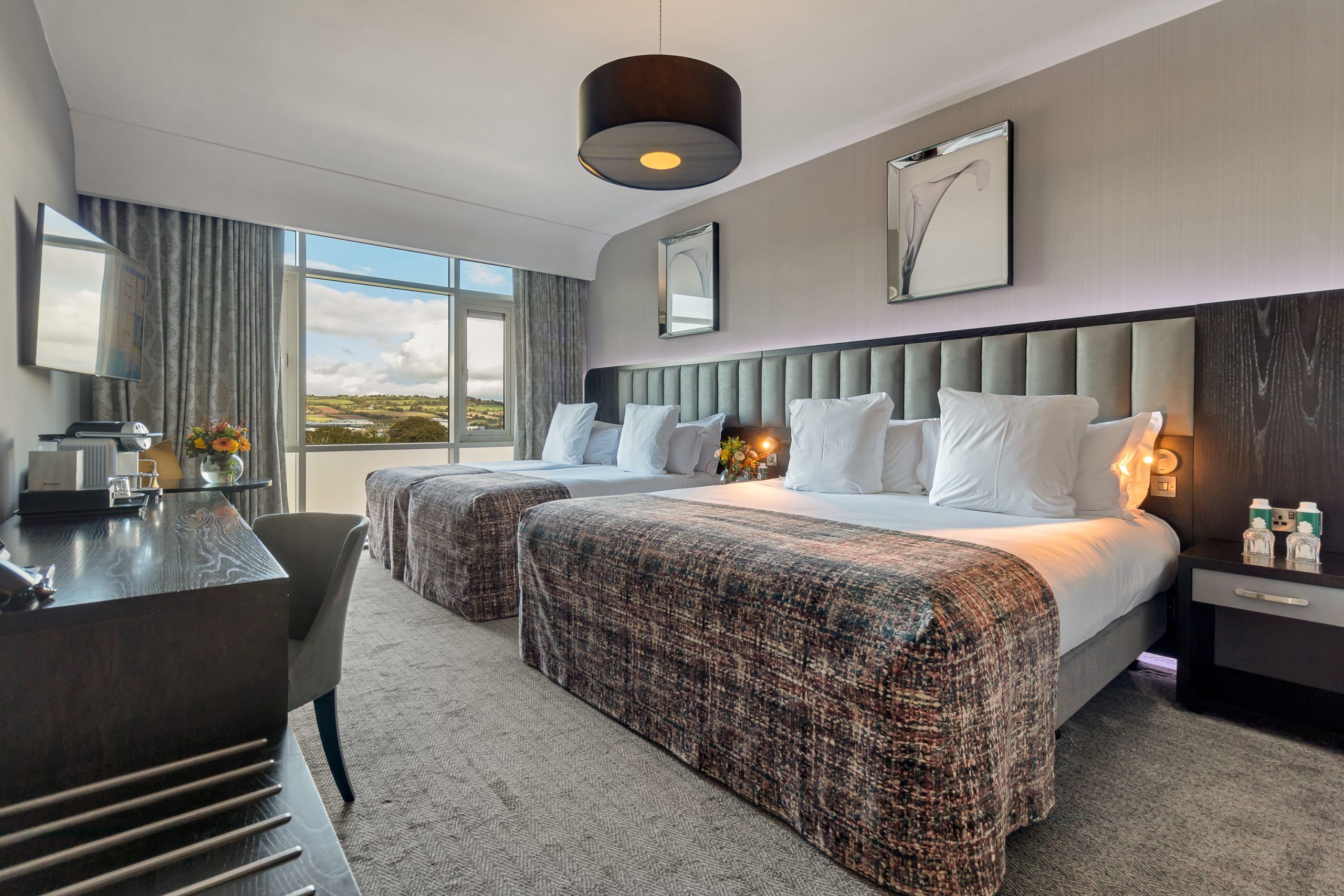 Family Bedroom image with double bed and two single beds